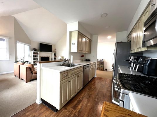 Fireplace, Interior, Kitchen, Recessed Lighting, Stainless Steel Appliances, Wood Texture Flooring