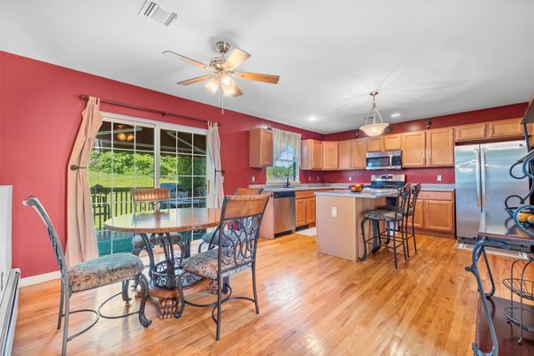 Dining room, Interior, Kitchen, Pendant Lights, Recessed Lighting, Stainless Steel Appliances, Wood Texture Flooring