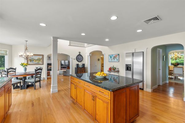 Chandelier, Dining room, Fireplace, Interior, Kitchen, Recessed Lighting, Stainless Steel Appliances, Wood Texture Flooring