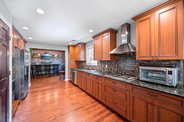 Dining room, Interior, Kitchen, Pendant Lights, Recessed Lighting, Stainless Steel Appliances, Stone Walls, Wood Texture Flooring
