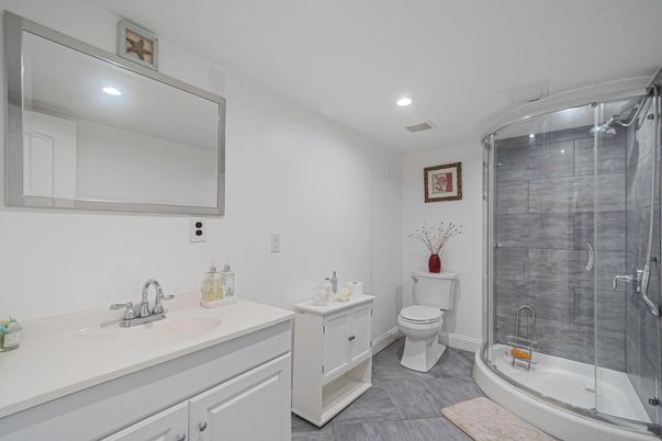 Bathroom, Dual Sink Vanities, Glass Shower, Interior, Recessed Lighting, Wood Texture Flooring