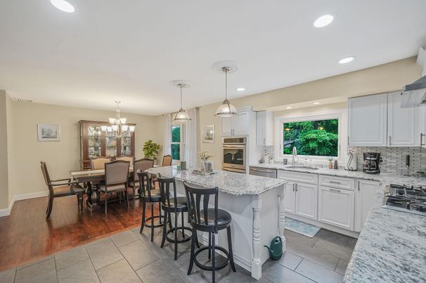 Chandelier, Dining room, Interior, Kitchen, Pendant Lights, Recessed Lighting, Stainless Steel Appliances, Wood Texture Flooring