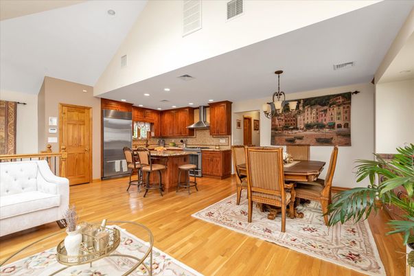 Chandelier, Dining room, Interior, Kitchen, Pendant Lights, Recessed Lighting, Stainless Steel Appliances, Wood Texture Flooring