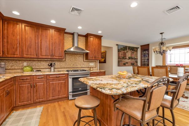 Chandelier, Dining room, Interior, Kitchen, Recessed Lighting, Stainless Steel Appliances, Wood Texture Flooring