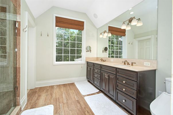 Bathroom, Dual Sink Vanities, Glass Shower, Interior, Recessed Lighting, Wood Texture Flooring