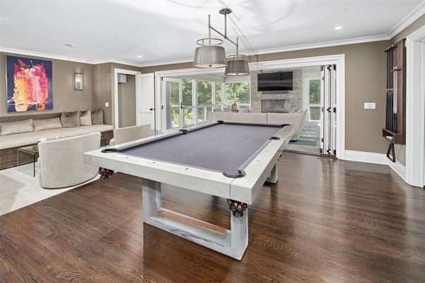 Billiard Table, Fireplace, Game Room, Interior, Living room, Pendant Lights, Recessed Lighting, Wood Texture Flooring