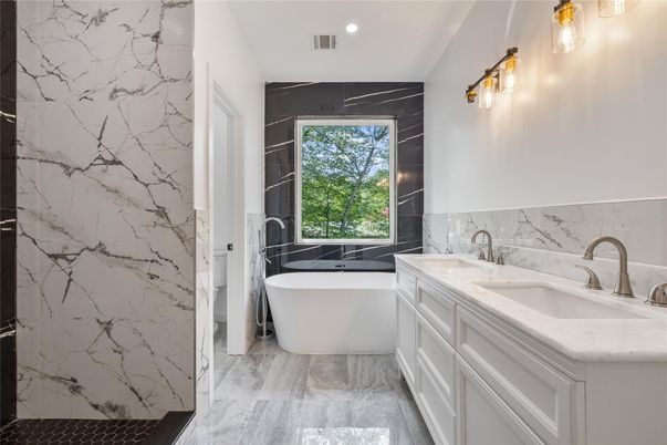 Bathroom, Dual Sink Vanities, Free Standing Baths, Interior, Marble, Marble Walls, Recessed Lighting