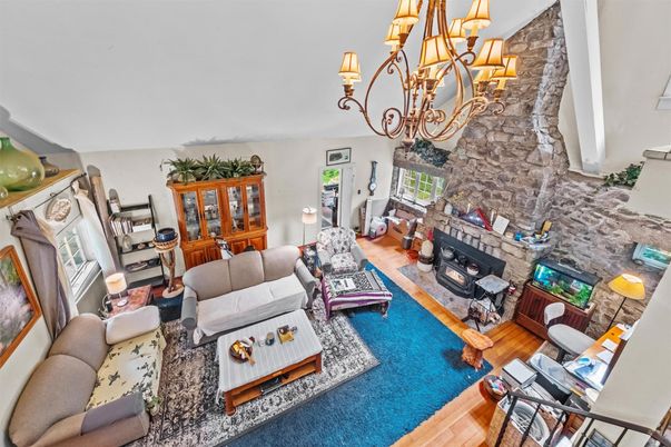 Chandelier, Fireplace, Interior, Living room, Stone Walls, Wood Texture Flooring