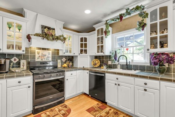 Interior, Kitchen, Recessed Lighting, Tile Countertops, Wood Texture Flooring