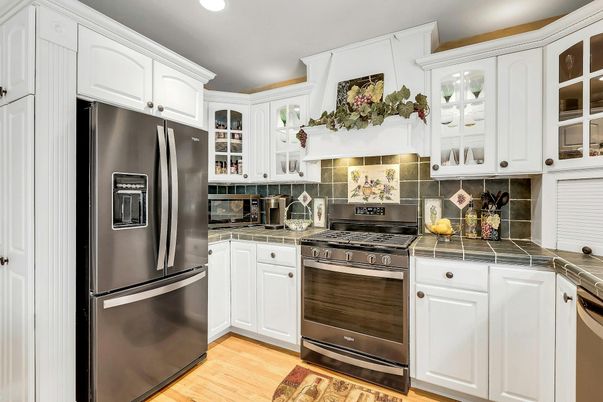 Interior, Kitchen, Recessed Lighting, Stainless Steel Appliances, Tile Countertops, Wood Texture Flooring