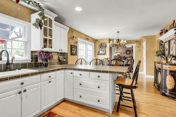 Chandelier, Dining room, Interior, Kitchen, Recessed Lighting, Tile Countertops, Wood Texture Flooring