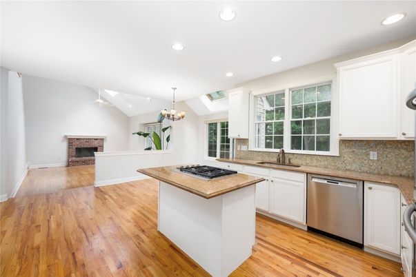 Chandelier, Fireplace, Interior, Kitchen, Recessed Lighting, Wood Texture Flooring
