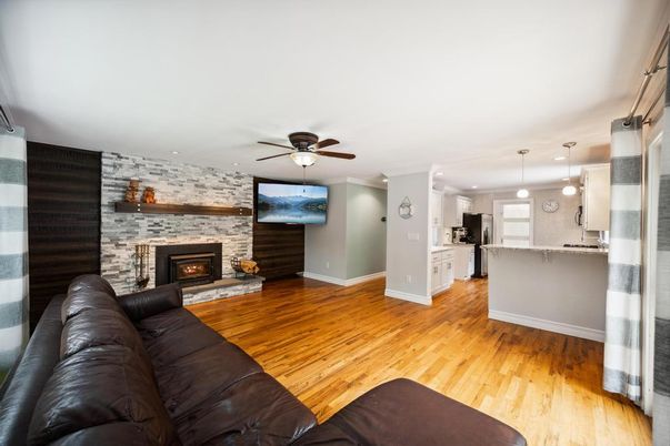 Fireplace, Interior, Kitchen, Living room, Pendant Lights, Recessed Lighting, Stone Walls, Wood Texture Flooring