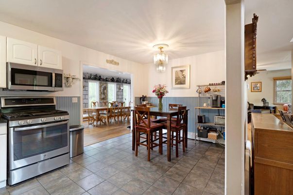 Chandelier, Dining room, Interior, Kitchen, Stainless Steel Appliances, Wood Texture Flooring