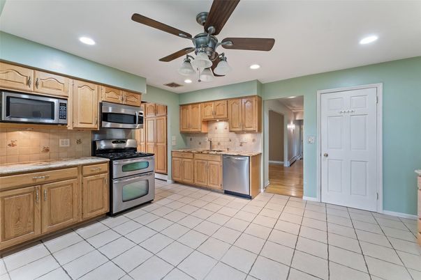 Interior, Kitchen, Recessed Lighting, Stainless Steel Appliances, Tile Countertops