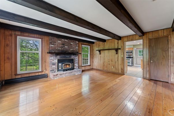 Empty room, Fireplace, Interior, Kitchen, Recessed Lighting, Stone Walls, Wooden Beams, Wood Texture Flooring, Wooden Walls