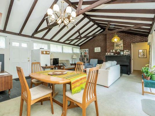 Chandelier, Dining room, Fireplace, Interior, Living room, Stone Walls, Wooden Beams