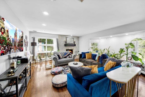 Fireplace, Interior, Living room, Recessed Lighting, Stone Walls, Wood Texture Flooring