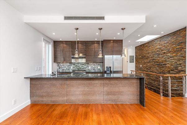 Interior, Kitchen, Pendant Lights, Recessed Lighting, Stainless Steel Appliances, Stone Walls, Wood Texture Flooring