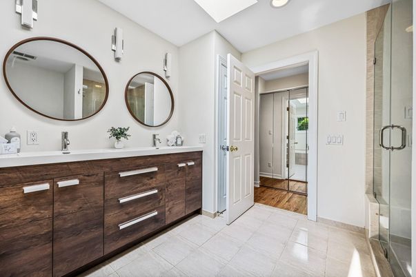 Bathroom, Dual Sink Vanities, Glass Shower, Interior, Recessed Lighting, Wood Texture Flooring