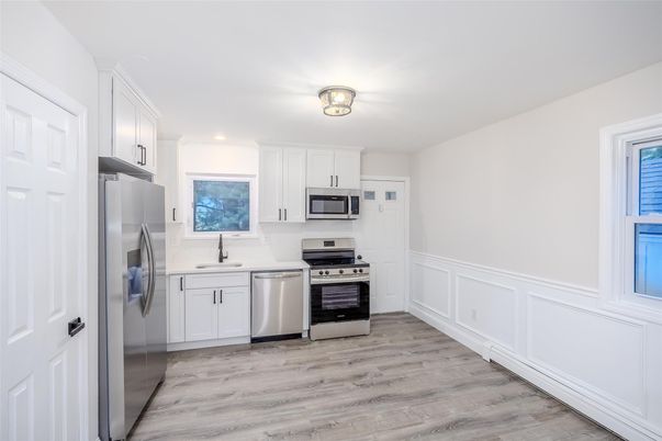 Interior, Kitchen, Recessed Lighting, Stainless Steel Appliances, Wood Texture Flooring