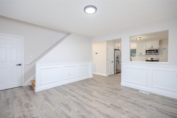 Empty room, Interior, Kitchen, Stainless Steel Appliances, Wood Texture Flooring
