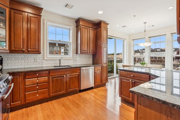 Dining room, Interior, Kitchen, Pendant Lights, Recessed Lighting, Stainless Steel Appliances, Wood Texture Flooring