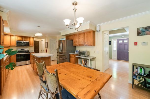 Chandelier, Dining room, Interior, Kitchen, Stainless Steel Appliances, Wood Texture Flooring