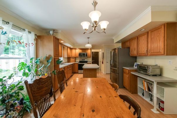 Chandelier, Dining room, Interior, Kitchen, Recessed Lighting, Stainless Steel Appliances, Wood Texture Flooring
