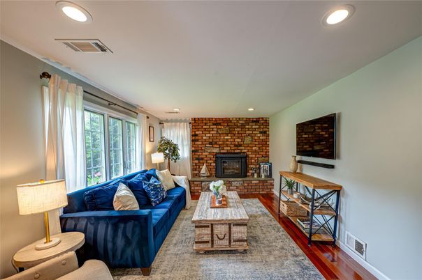 Fireplace, Interior, Living room, Recessed Lighting, Stone Walls, Wood Texture Flooring