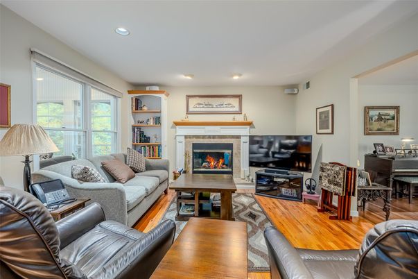 Fireplace, Interior, Living room, Piano, Recessed Lighting, Wood Texture Flooring