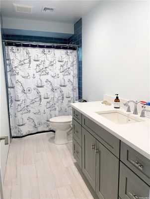 Bathroom, Dual Sink Vanities, Interior, Marble Walls, Wood Texture Flooring