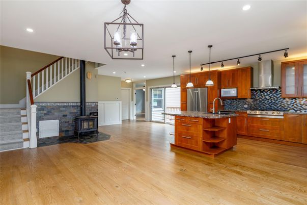 Fireplace, Interior, Kitchen, Pendant Lights, Recessed Lighting, Stainless Steel Appliances, Wood Texture Flooring