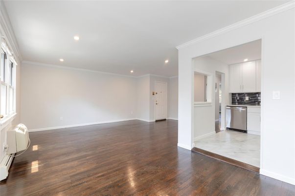 Empty room, Interior, Kitchen, Marble, Recessed Lighting, Stainless Steel Appliances, Wood Texture Flooring