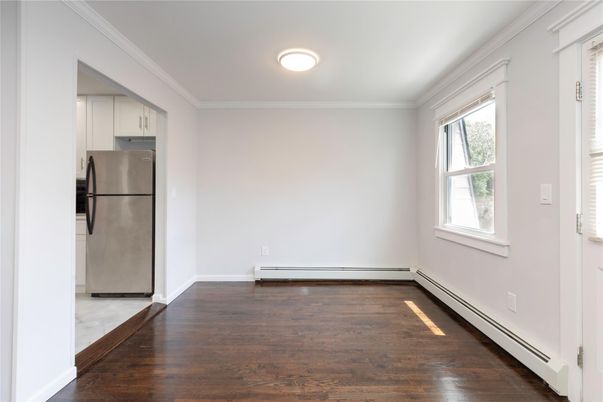 Empty room, Interior, Kitchen, Recessed Lighting, Stainless Steel Appliances, Wood Texture Flooring