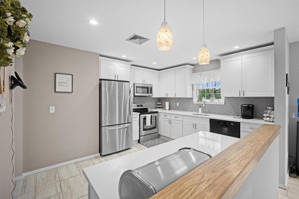 Interior, Kitchen, Pendant Lights, Recessed Lighting, Stainless Steel Appliances, Wood Texture Flooring