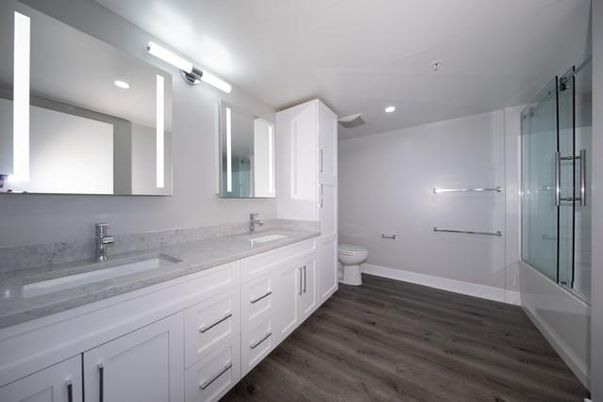 Bathroom, Dual Sink Vanities, Glass Shower, Interior, Recessed Lighting, Wood Texture Flooring