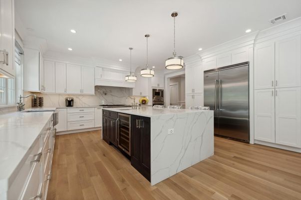 Interior, Kitchen, Marble Walls, Pendant Lights, Recessed Lighting, Stainless Steel Appliances, Wood Texture Flooring