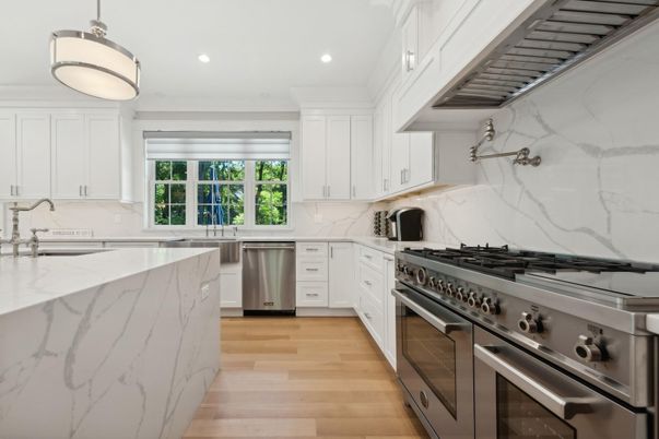 Interior, Kitchen, Marble Walls, Pendant Lights, Recessed Lighting, Stainless Steel Appliances, Wood Texture Flooring