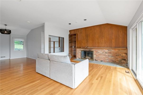 Fireplace, Interior, Living room, Recessed Lighting, Stone Walls, Wood Texture Flooring