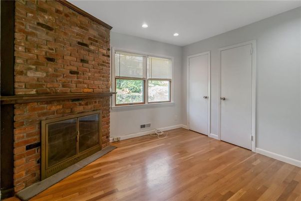 Empty room, Fireplace, Interior, Recessed Lighting, Stone Walls, Wood Texture Flooring