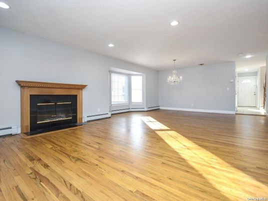 Chandelier, Empty room, Fireplace, Interior, Recessed Lighting, Wood Texture Flooring