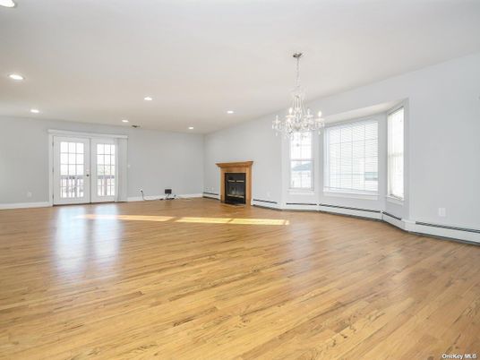 Chandelier, Empty room, Fireplace, Interior, Recessed Lighting, Wood Texture Flooring
