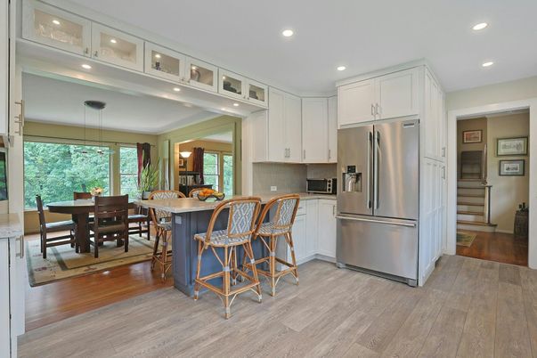 Dining room, Interior, Kitchen, Pendant Lights, Recessed Lighting, Stainless Steel Appliances, Wood Texture Flooring