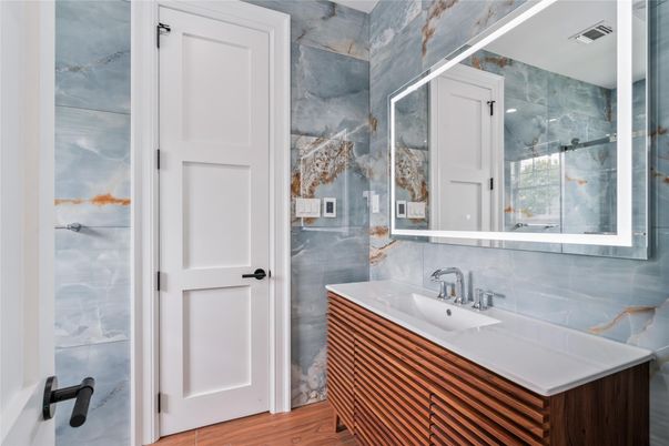 Bathroom, Glass Shower, Interior, Marble Walls, Wood Texture Flooring