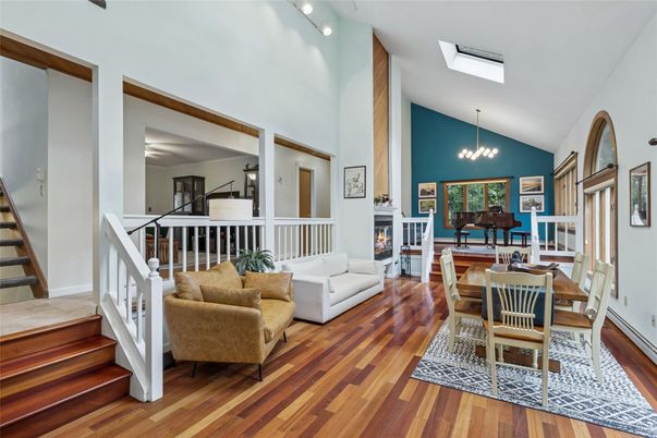 Chandelier, Dining room, Fireplace, Interior, Living room, Pendant Lights, Piano, Wood Texture Flooring