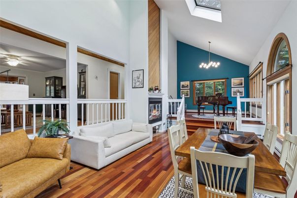 Chandelier, Dining room, Fireplace, Interior, Living room, Pendant Lights, Piano, Wood Texture Flooring