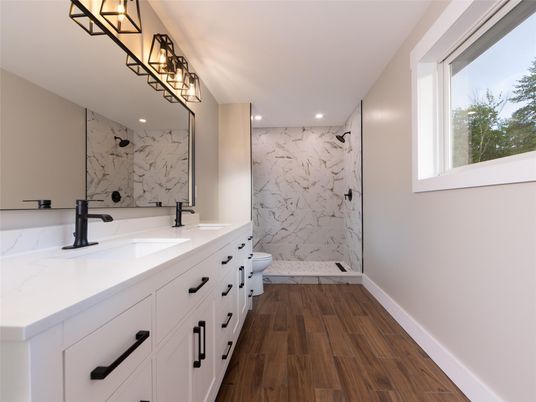 Bathroom, Dual Sink Vanities, Glass Shower, Interior, Marble Walls, Recessed Lighting, Wood Texture Flooring