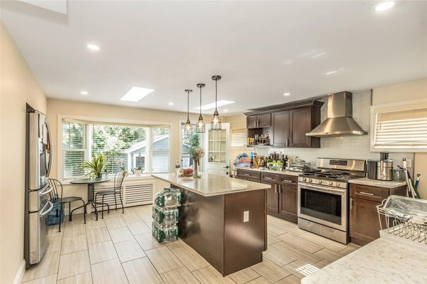 Dining room, Interior, Kitchen, Pendant Lights, Recessed Lighting, Stainless Steel Appliances, Wood Texture Flooring