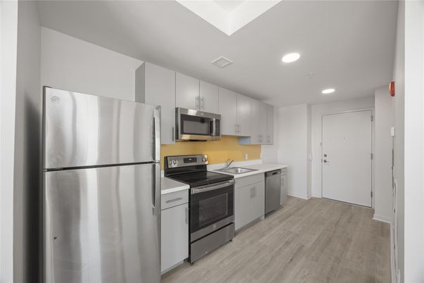 Interior, Kitchen, Recessed Lighting, Stainless Steel Appliances, Wood Texture Flooring